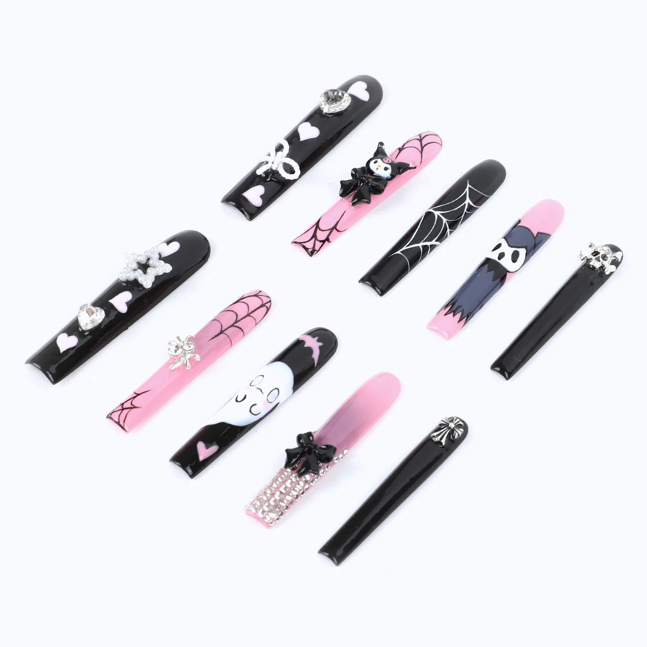 The black and pink manicure, with spider webs and cartoon characters, shows a quirky style