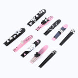 The black and pink manicure, with spider webs and cartoon characters, shows a quirky style