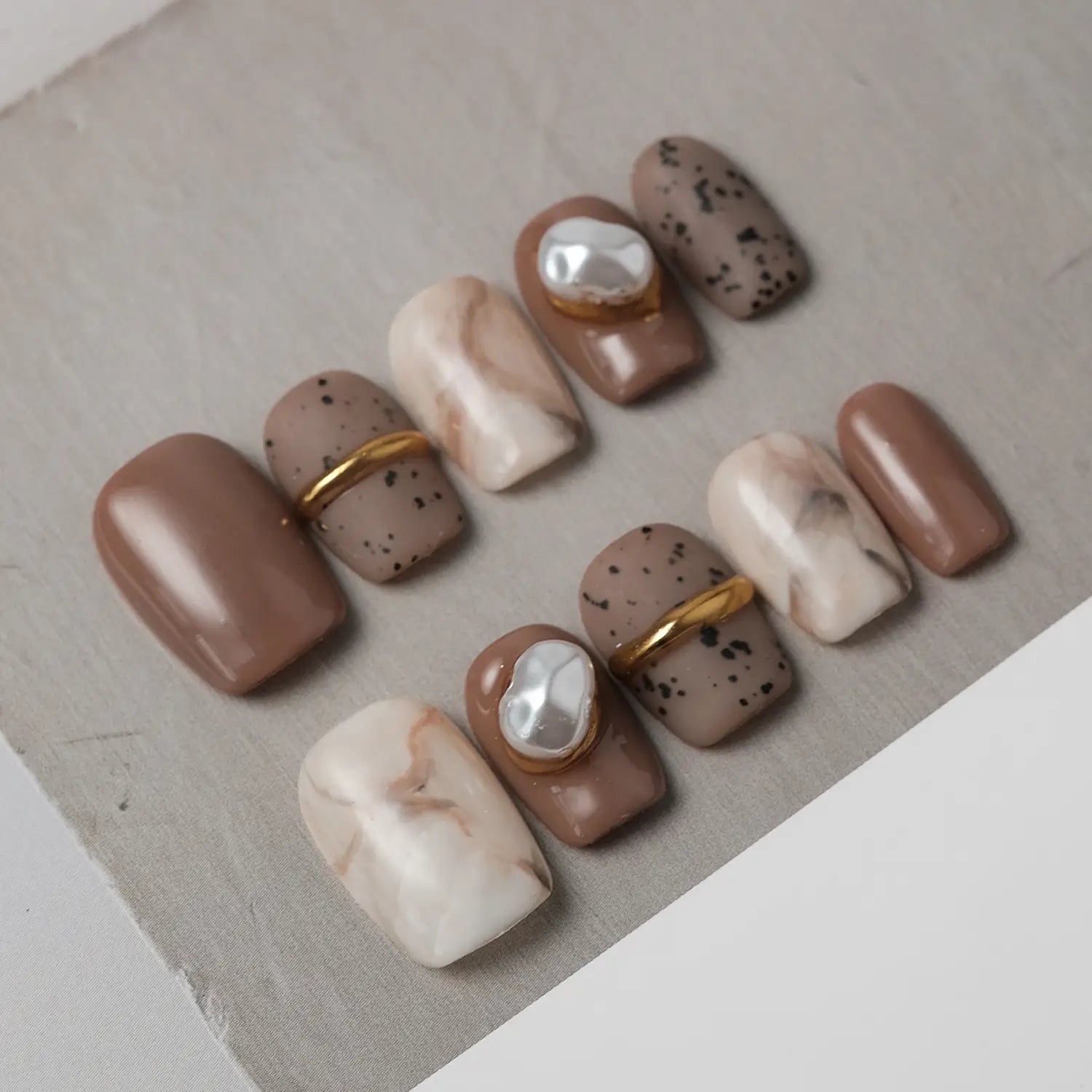 Press on Nails from the left side, showing the clear nail shape and delicate design