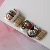 Press-on nails from the right side highlight the 3D nail design