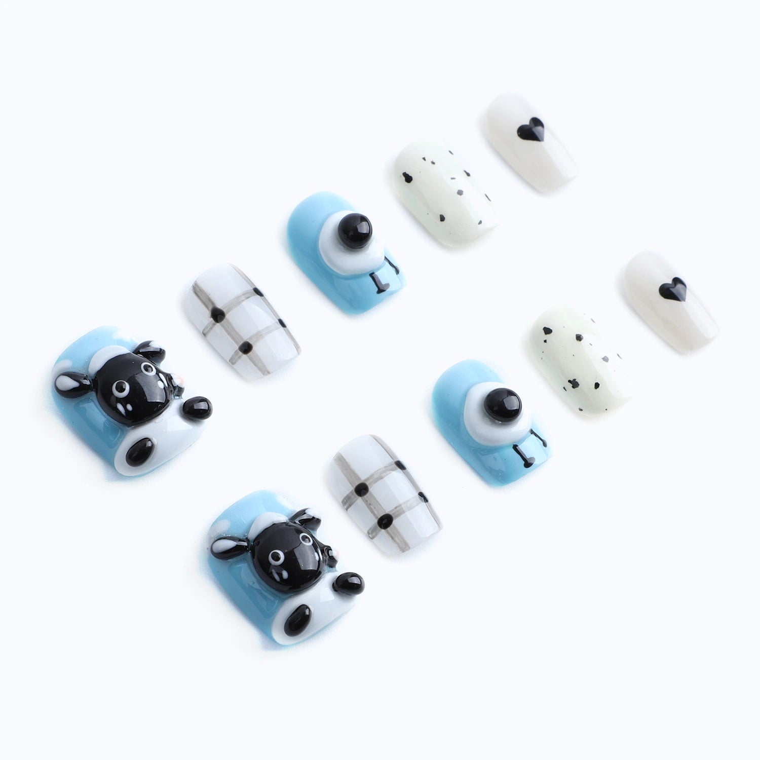 Press-on nails with a charming combination of cute sheep patterns, big cartoon eyes and sweet heart patterns