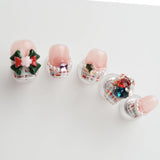 The nails are pink with a classic red and white checkered pattern