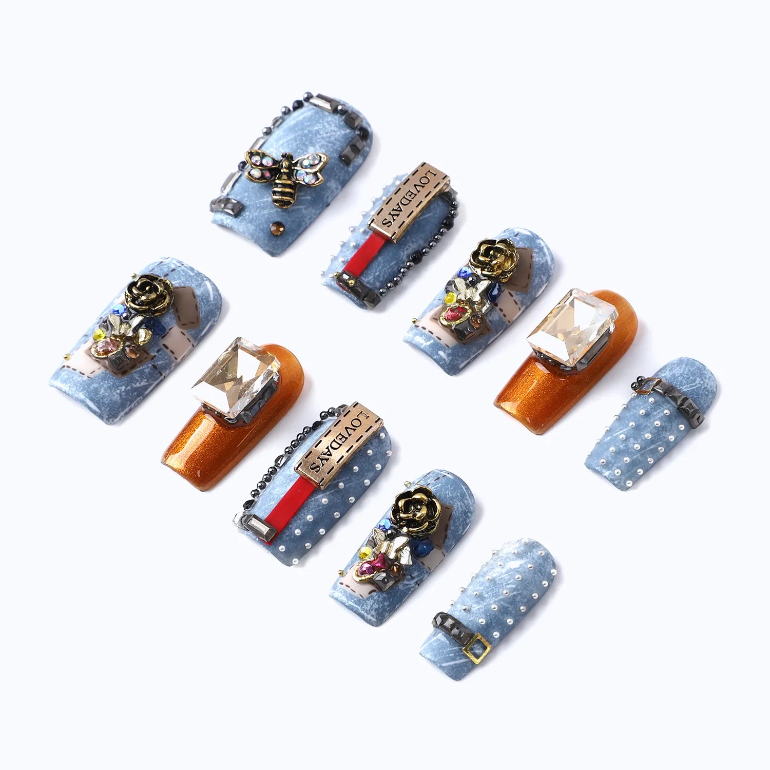 The nail ideas have two main base colors: one has a denim texture of blue, and the other is shiny orange. 