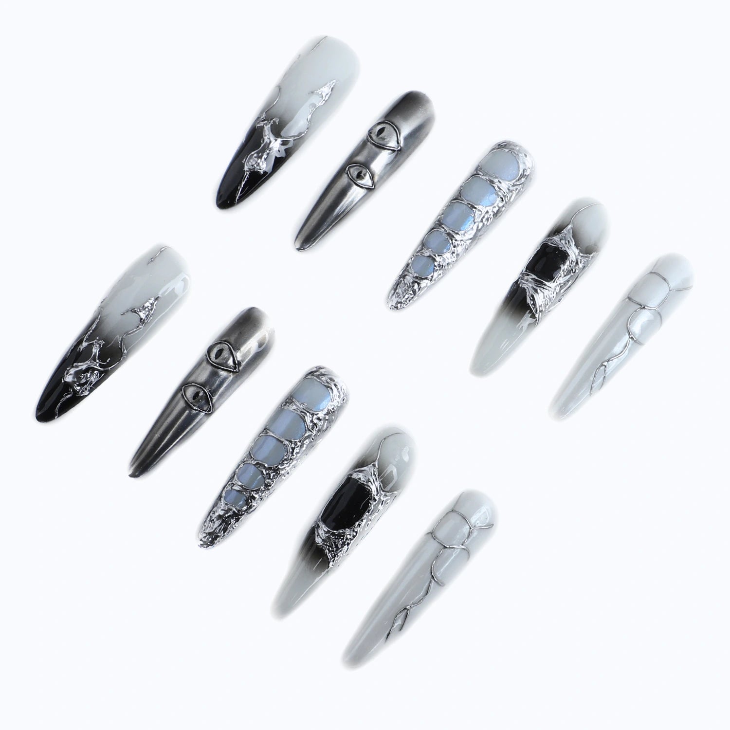 Silver, black and white press-on nails with eyes, crackle texture and marble-like patterns