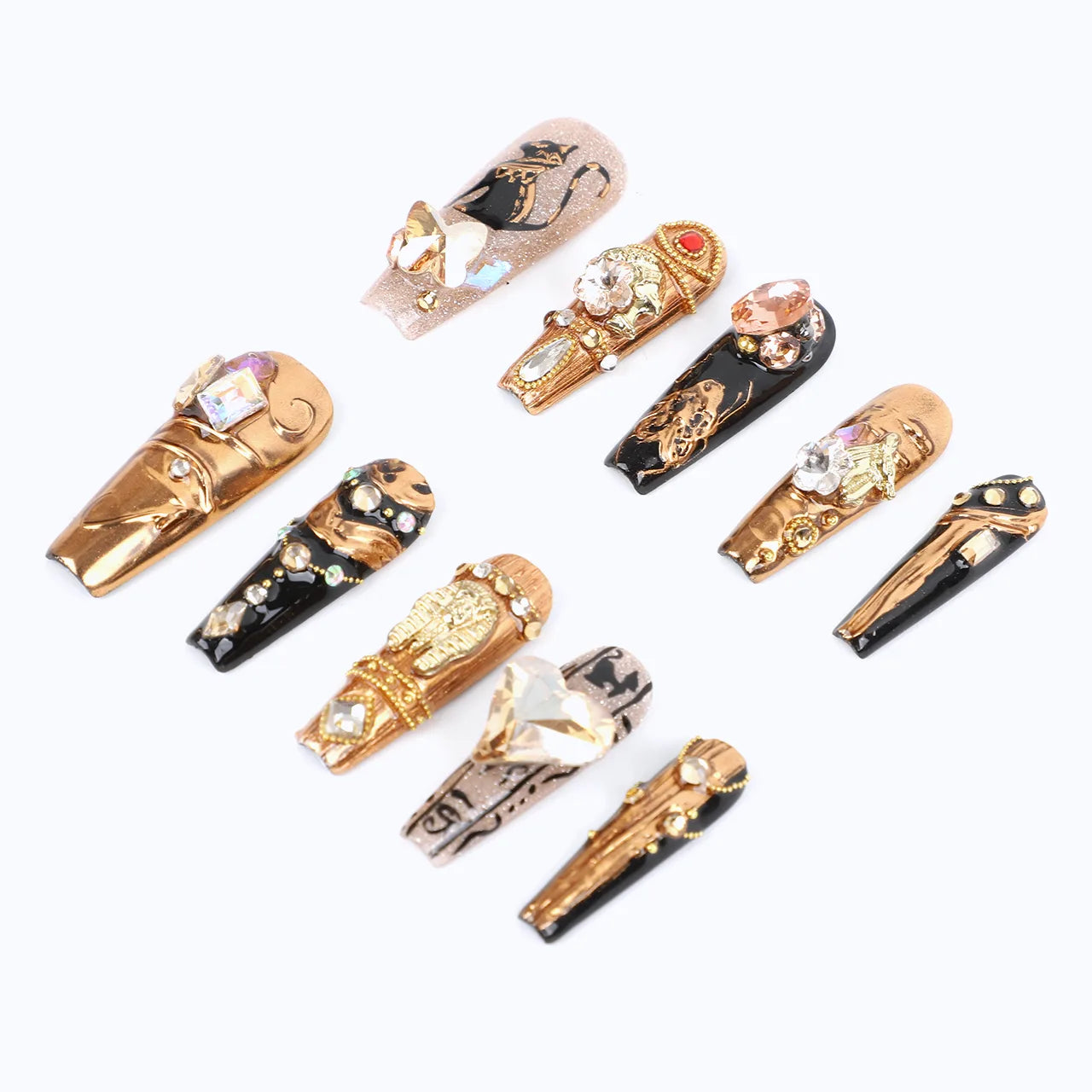 A side view of press-on nails, creating a mysterious and opulent Egyptian-inspired design.