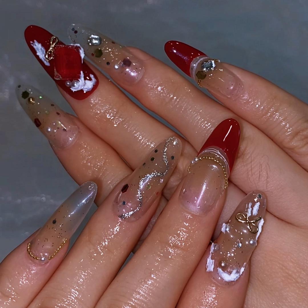 Christmas long almond acrylic nails with gold glitter gloss
