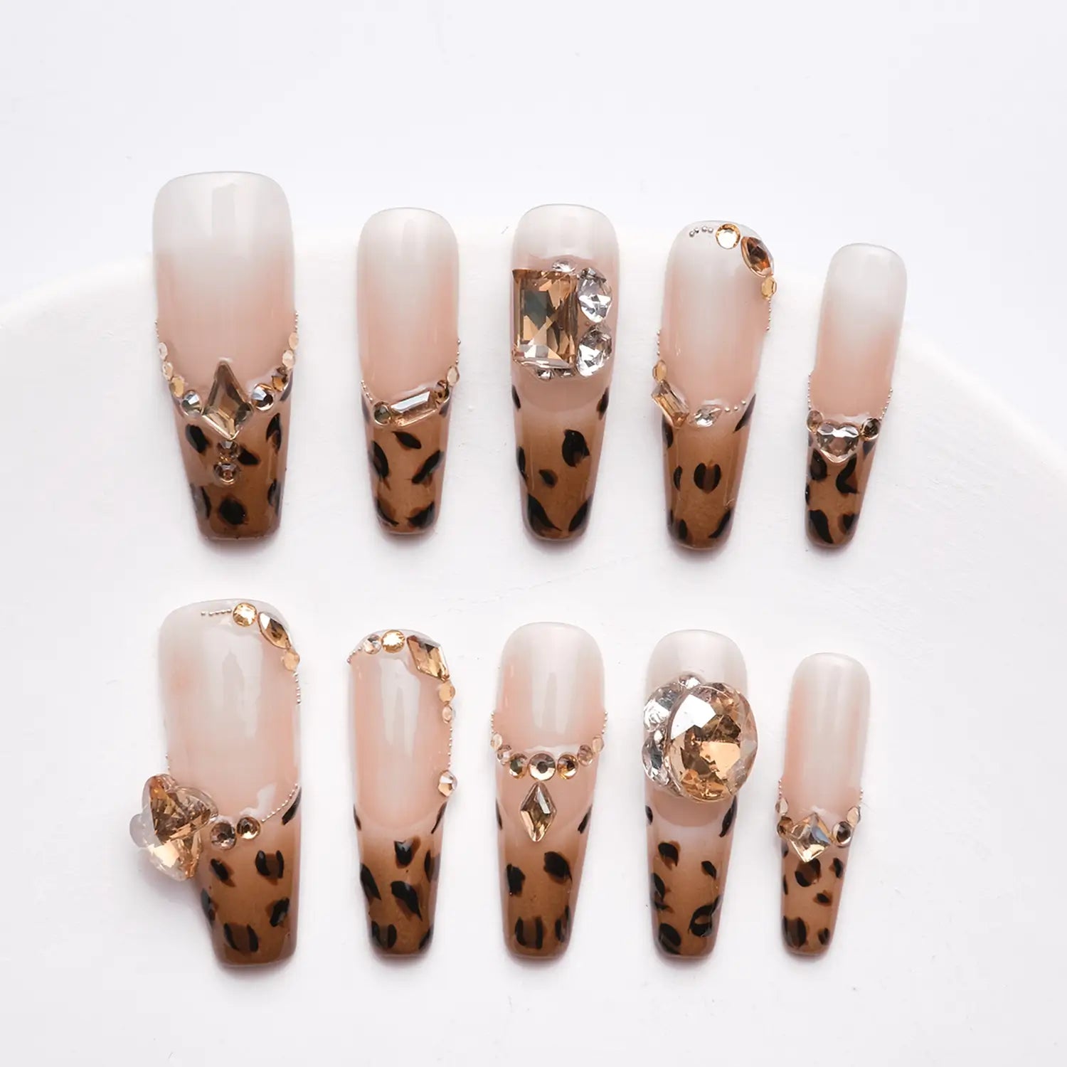  Each nail is adorned with a different leopard print pattern 