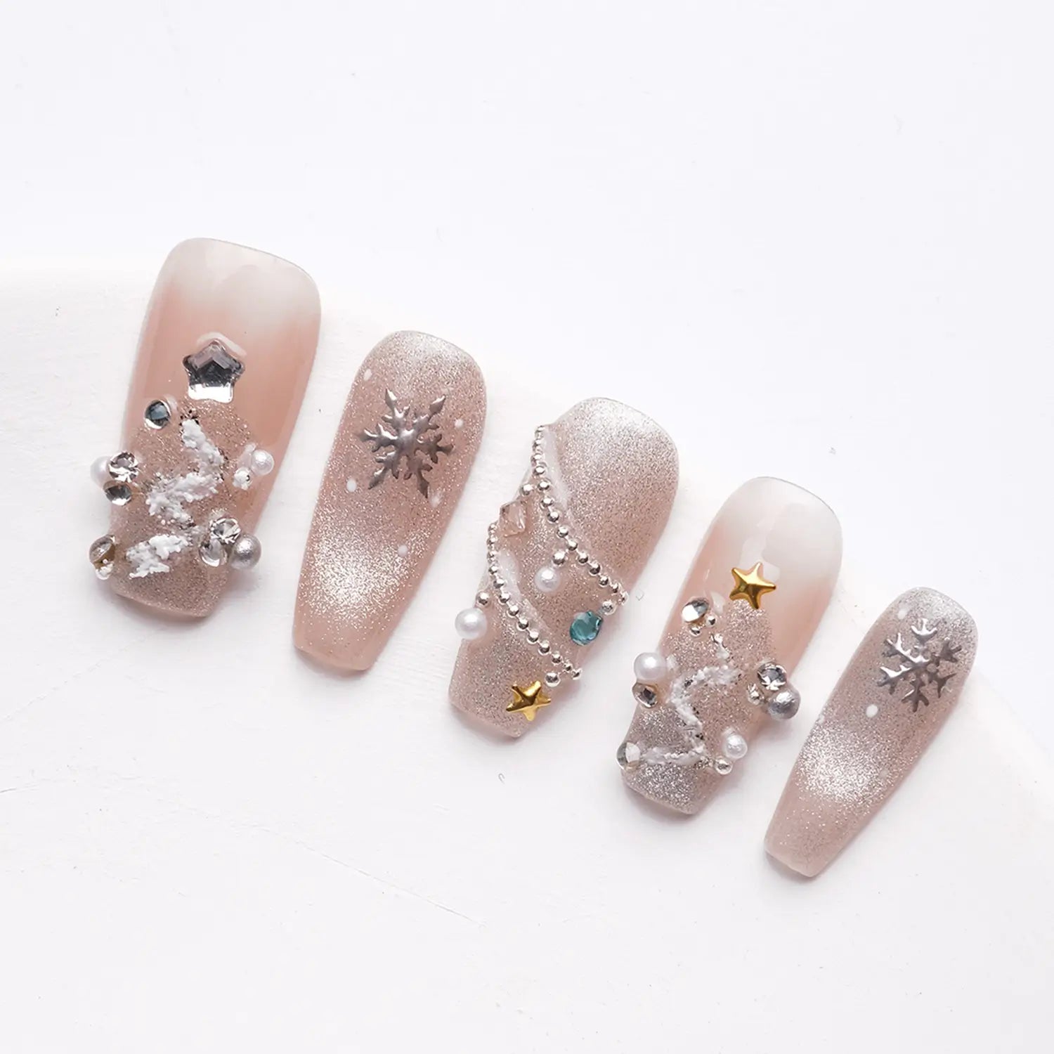Press-on nails from a side view, showing the clear nail shape and the exquisite design of 3D diamond, pearl and snowflake nails.