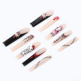 Press on nails are mainly black, white and red, dotted with cartoon patterns, spider webs and cross shapes